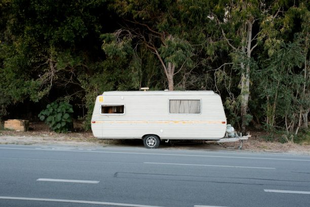 White caravan parked on an Australian roadside, needing keys and door locks
